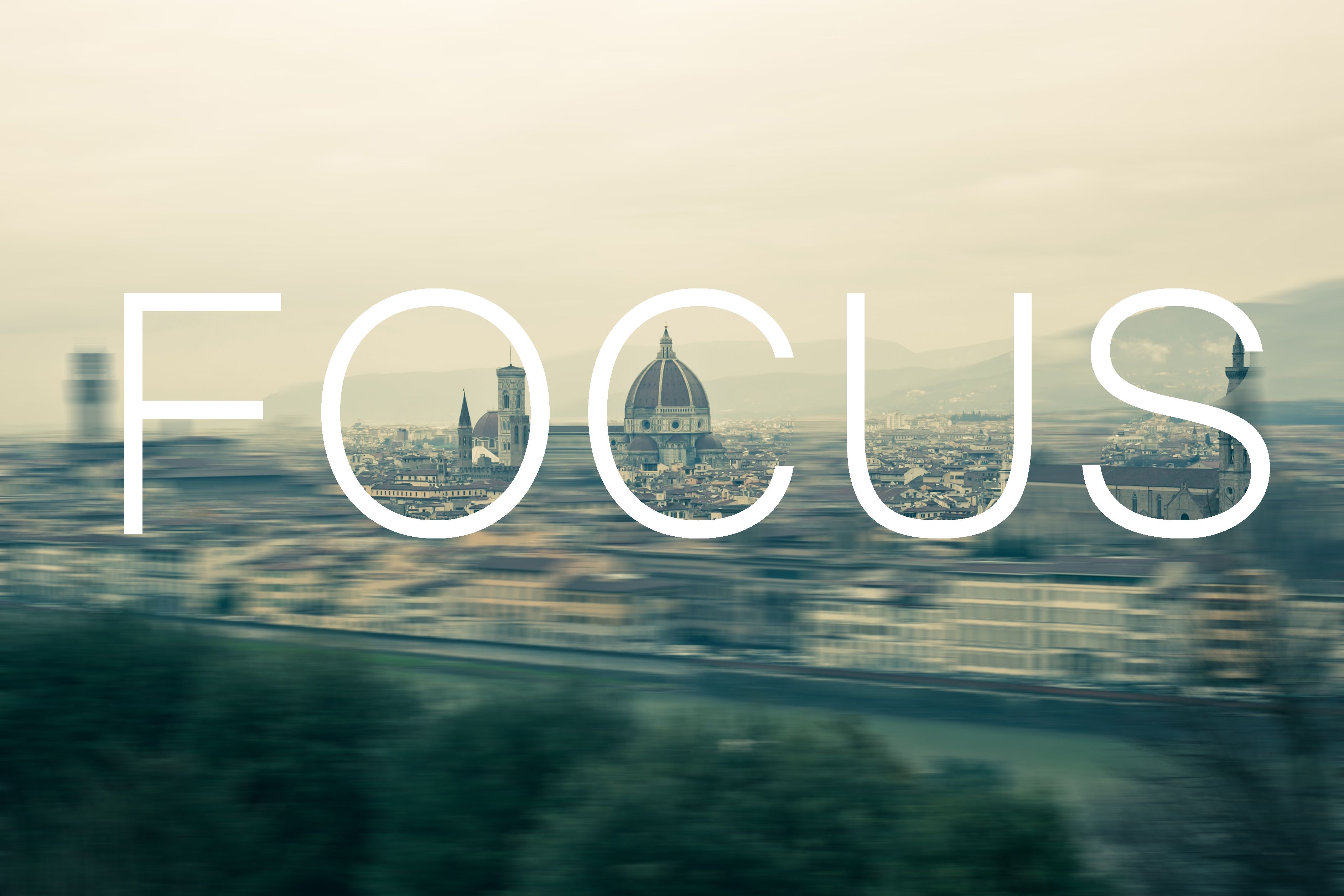 Image of city in the background with the word Focus overtop