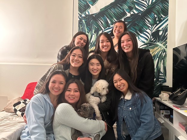 Group of people standing together and smiling