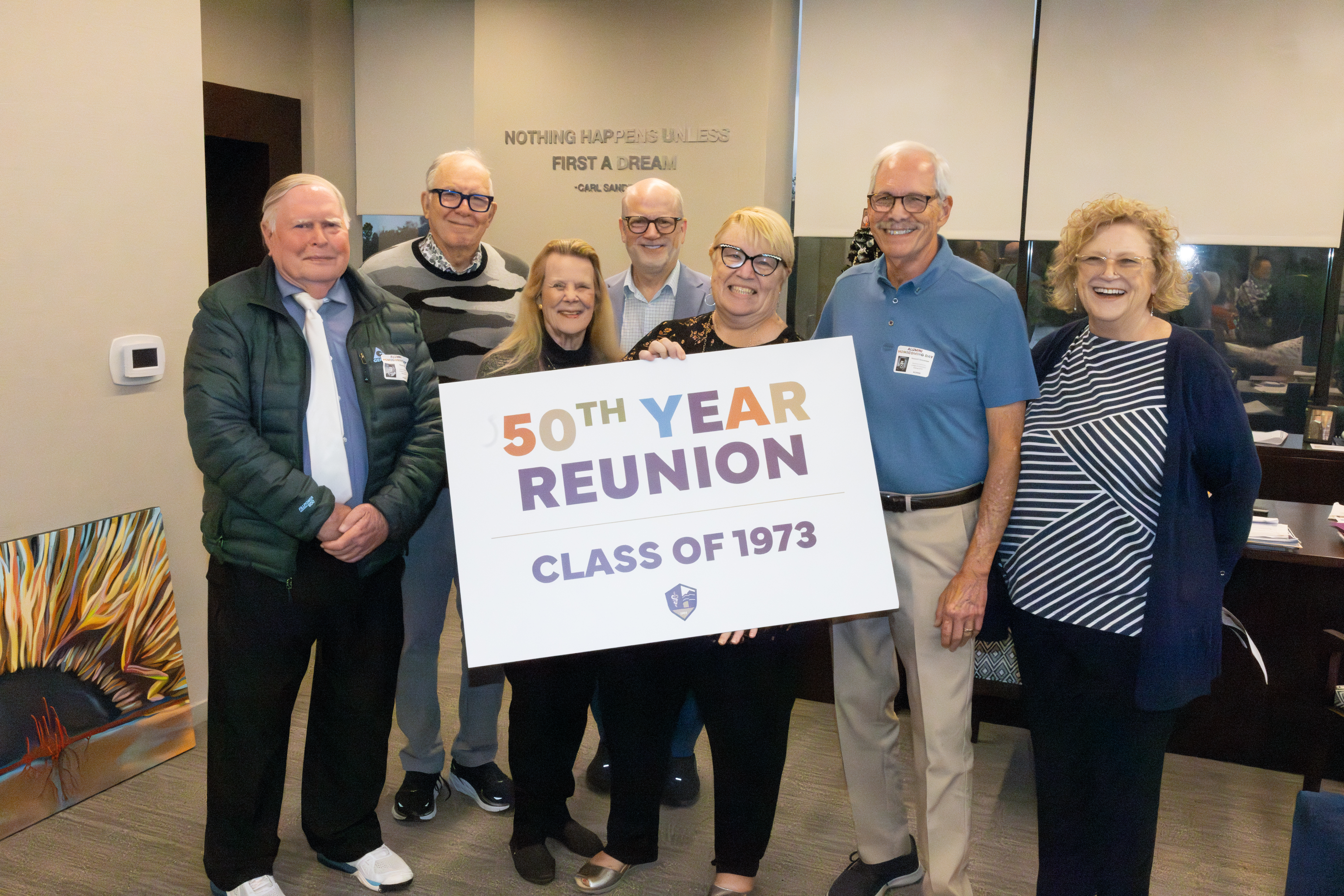 President Schornack poses with Class of 1973 reunion attendees
