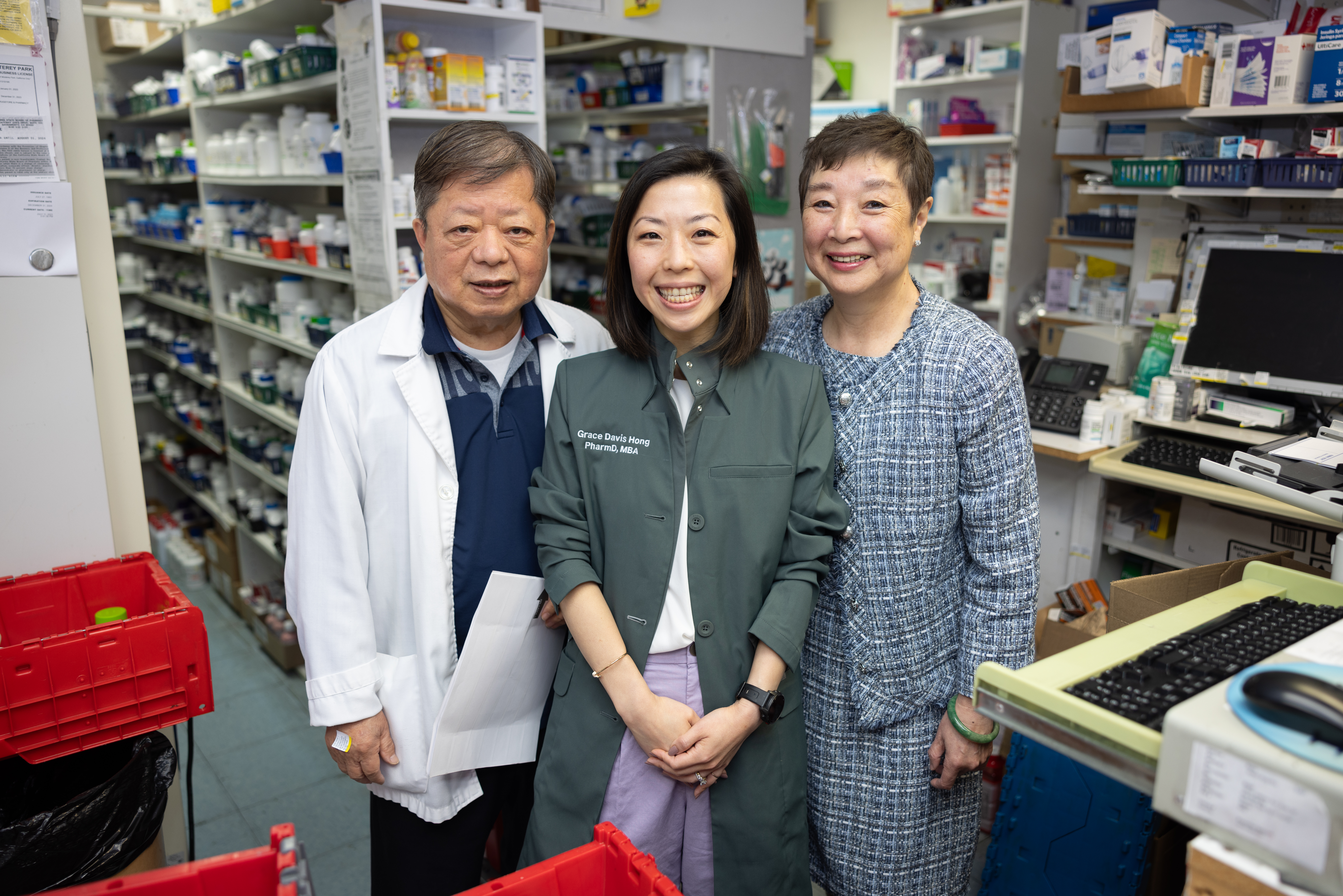Dr. Grace Hong and her parents at their family owned pharmacy
