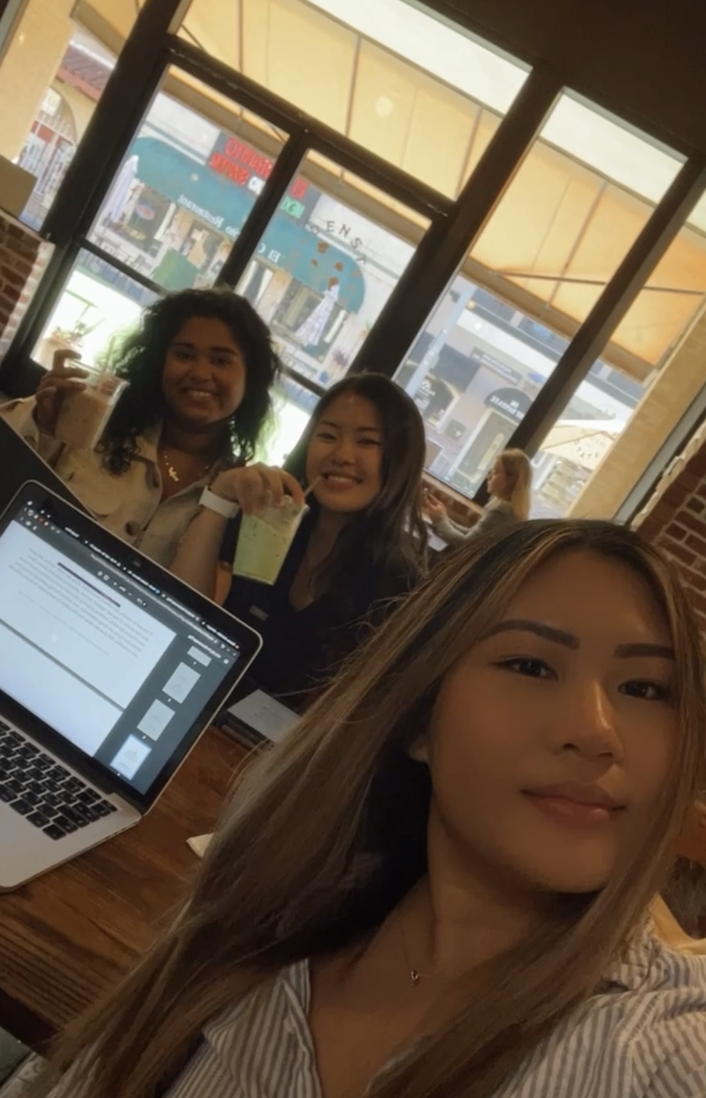 Photo of students studying at a local cafe