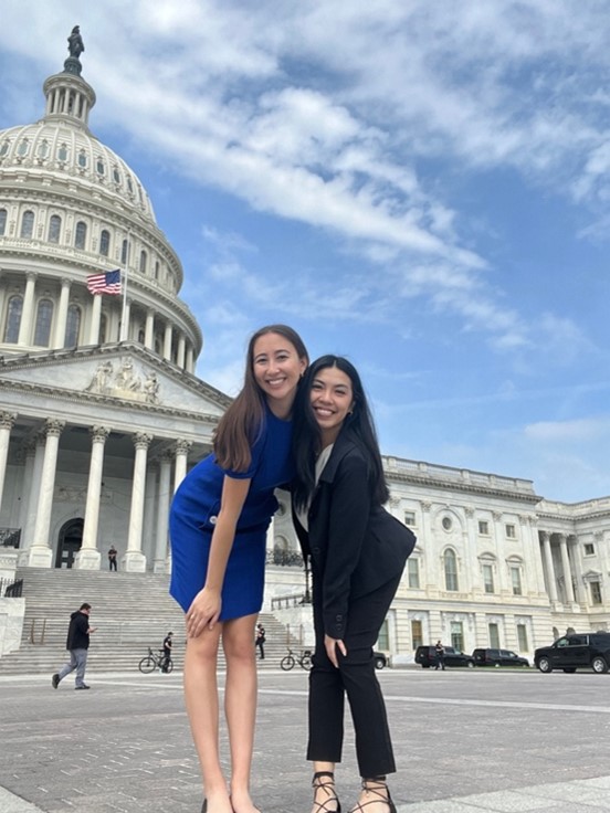 Photo of two students at a national conference