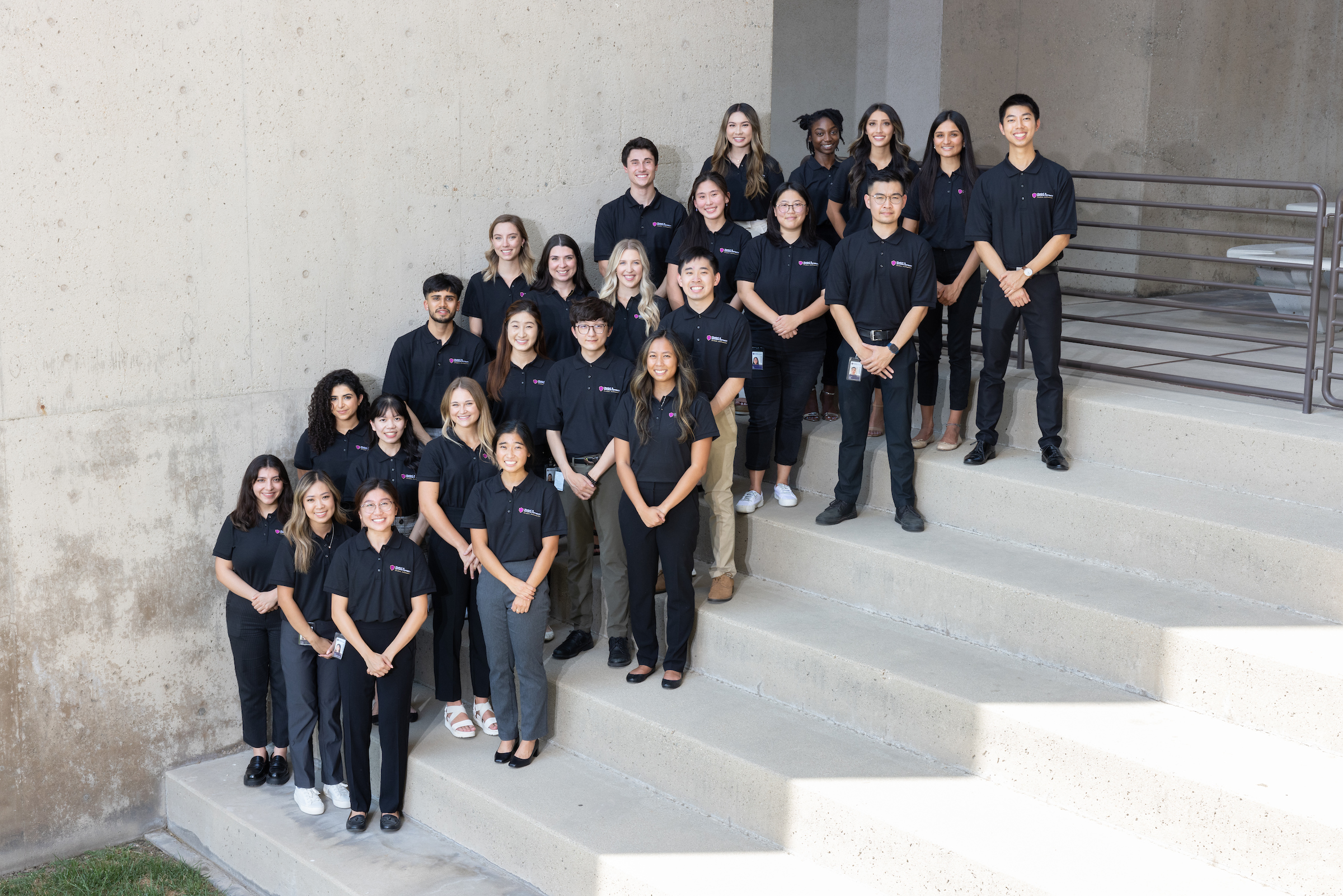 MBKU Student Ambassadors group photo, posed on stairs