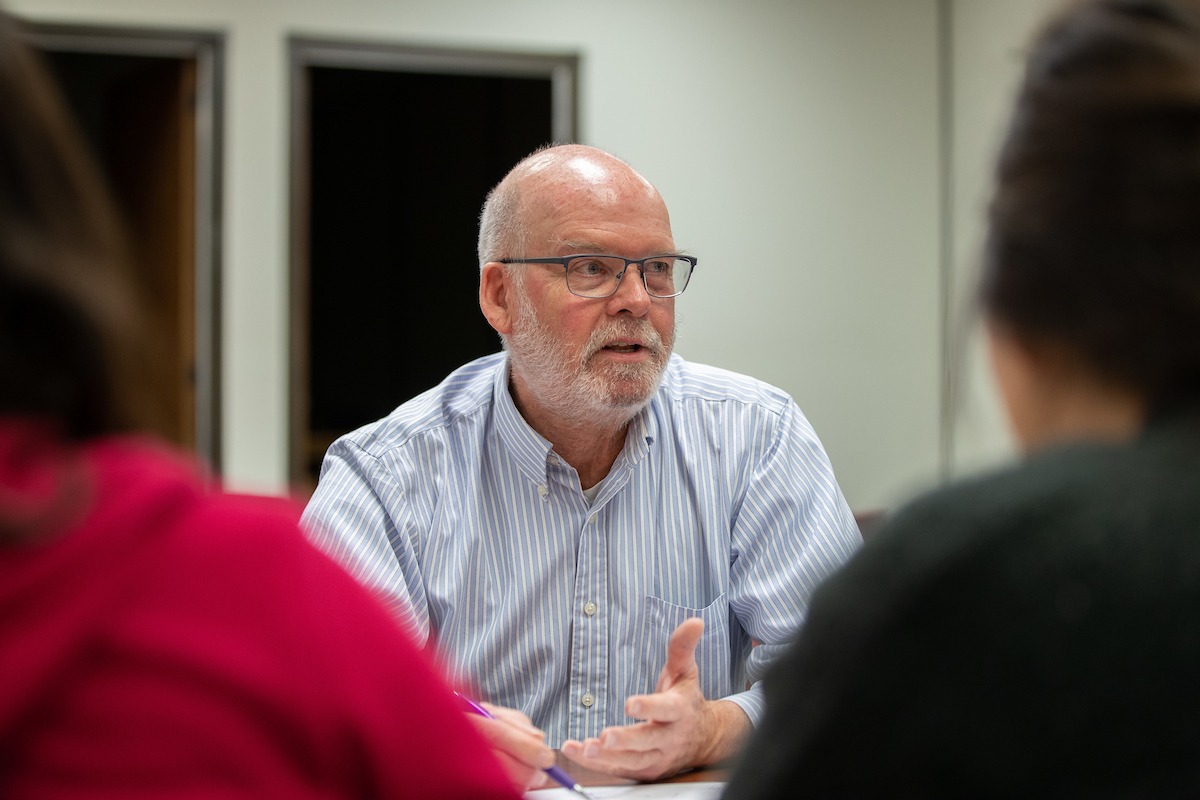 Dr. Edrington talking to students during office hours