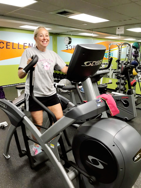 April Shaw using the elliptical inside the MBKU Fitness Center