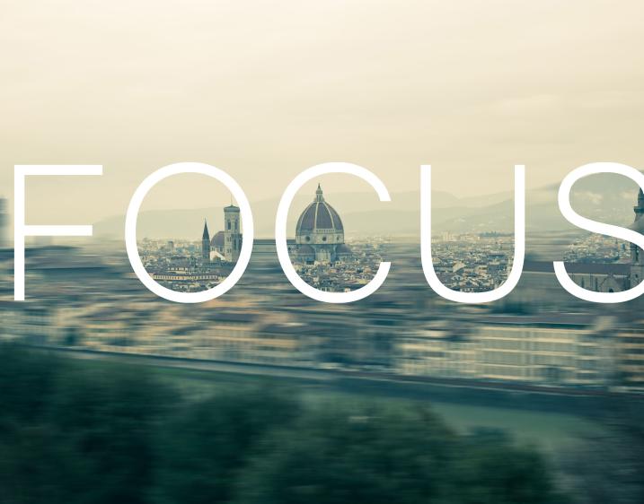 Image of city in the background with the word Focus overtop