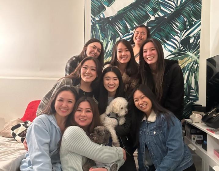 Group of people standing together and smiling