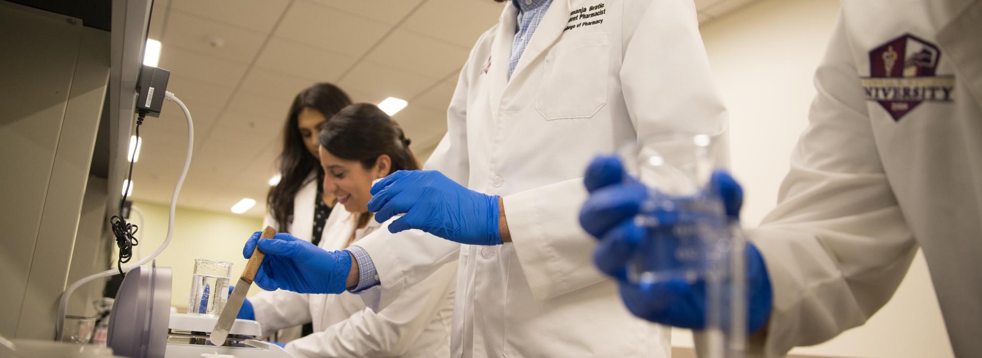 Pharmacy students in the compounding lab.