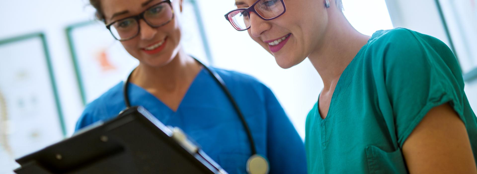 doctors looking at clipboard