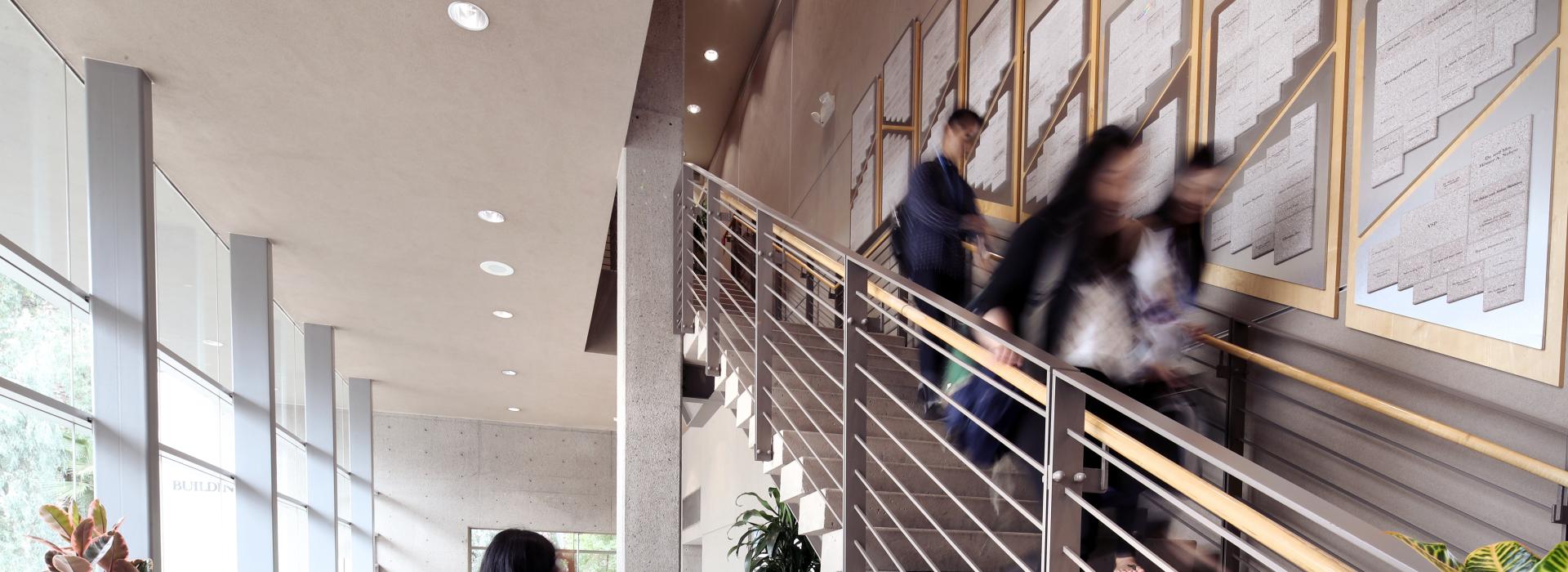 Students walking in the library