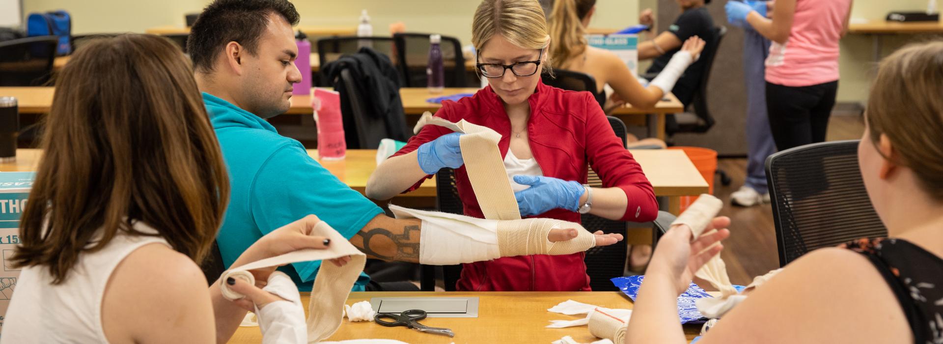 PA students learning how to wrap arm cast
