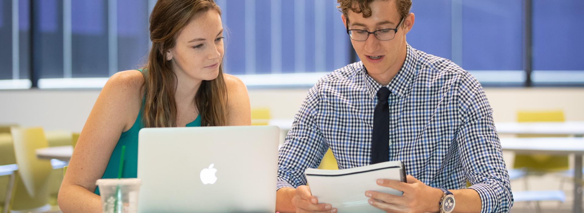 2 optometry students study together inside the Student Lounge